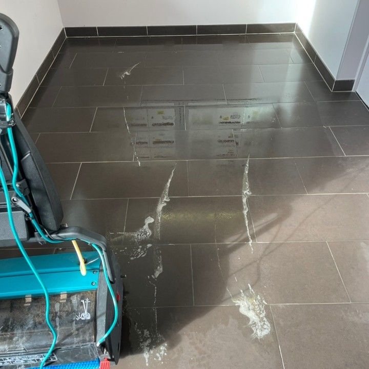 Industrial floor cleaning in progress